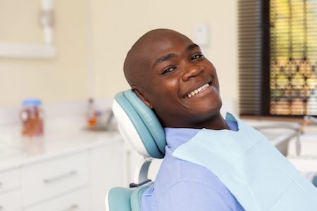 african man visiting dentist to get one of many dental services available at Freedom Family Dentistry in Fredericksburg, VA. 