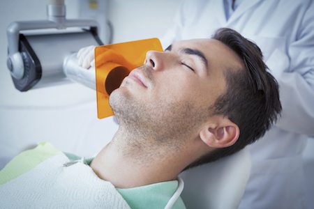 Male patient sleeping after dental sedation