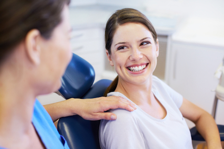 woman smiling after getting a dental filling at Freedom Family Dentistry