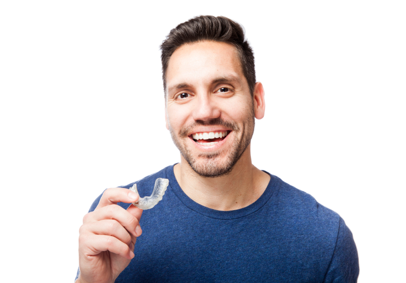 man putting in his Invisalign clear aligners he got from Freedom Family Dentistry